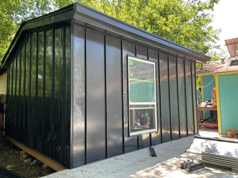 Black standing seam metal wall panels for Roof Inspection in Port Salerno